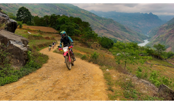 This Northern Vietnam Motorbike Tour Hanoi  offers  full chances to discover Ha Giang, Ba Be National Park, Ba Be lake, Mai Chau valley and Sa pa… They are the most attractive destinations in North Vietnam.You will have a great album of stunning landscapes of mountainous regions and colorful hill tribes as an 8 day riding motorbike in northern Vietnam with an experienced local team of Vietnam Motorbike Trips. This is one of our pick of the Vietnam Motorcycle Tour Collection.Day 1:  Hanoi  – Ba Be Lake: 240 km This great Northern Vietnam Motorbike Tour up north of Vietnam starts at around 8 am. We try our best to avoid busy city roads in the morning until Cho Chu town( in Thai Nguyen province) where we have lunch. After lunch, we surely have an enjoyable motorcycle ride to Ba Be because the roads have less traffic and give you a lot of grand mountain views. At about 4 PM. We arrived at Pac Ngoi – a beautiful village of Tay people which is located peacefully at Ba Be lake’s side. Dinner and stay with Tay's family. Day 2:  Babe Lake  –  Meo Vac:   170 km Saying goodbye to  the family, we’ll ride bikes on the back-roads through some rustic villages and the jungle. Then we bike across some streams. This promises to be a great day for off-road Vietnam bike touring.We will stop in Bao Lac town for lunch and then continue the beautiful bike tour from Northern Vietnam to Meo Vac by taking a scenic route that climbs over many Passes where we can enjoy beautiful mountain ranges and the Nho Que river.  Arrive at Meo Vac by 5.00PM. Have dinner in town, and Hotel stay. Day 3: Meo Vac  –  Ha Giang:   180 Km Today’s ride promises to be the highlight of this motorcycle trip in north Vietnam as we will visit one of the most remote land in Vietnam where we can see many ethnic groups with their unique cultures and imposing mountains such as : Pi Leng Pass – one of the 4 longest and most beautiful passes in North Vietnam, the Rock Plateau, the Vuong palace in Dong Van, The “Heaven Gate” in Quan Ba. This is for sure the best bike ride in Vietnam with many interesting and amazing things in every meter of the road.  I Arrived in Ha Giang in the late afternoon.Dinner and stay with the other Tay’s family or stay in hotel in Ha Giang cityDay 4: Ha Giang   –   Sa Pa:   220km Today we head straight towards the North-western mountain where the main Fanxipan Mountain range dominates the road until Sapa. The road is very smooth with a good view of green mountain, rice fields between lovely villages of the hill tribes. After a short break in Lao Cai to see the Chinese border, we will have a very beautiful motorbike ride up to Sapa. This bike ride is up and up till 1.600 meters above sea level. It offers a great  view of the mountain with terrace fields and it must be one of the best bike rides in North Vietnam.Arrive in Sapa at around 5: 00 pm, overnight at a hotel in Sapa.Day 5:  Sapa   –  Mu Cang Chai:   150 kmYou are free to explore Sapa until 1.00PM, check out the hotel and we continue the route to Than Uyen, we will make a splendid climb up from Sapa to the top of the highest road pass in Vietnam (Tram Ton Pass). Crossing into Lai Chau Province at over 2000 m above sea level. This is a short motorbike ride but could be the most enjoyable bike tour from Sa pa. The ride offers you an amazing view of the Hoang Lien mountain ranges for miles and miles. We arrive in Mu Cang Chai by 5.00PM,Dinner and overnight in a hotel or doing home-stay with the Tay family.Day 6: Mu Cang Chai –  Phu Yen:    190 km We keep riding up and down into a forested and high mountain region populated by H’mong peoples. We will hike up a very high mountain pass before descending into a mountainous tea-growing region. Soon after we followed along the valley floor covered in a sea of rice surrounded by Hmong and Thai’s villages all the way to Phu Yen. Especially after lunch in Tu Le – a famous land for terrace fields so the ride through the villages and rice terraces. This is another highlight of this bike tour in North Vietnam.Arrive at Phu Yen town at 5:00Pm. Overnight at the hotel.Day 7: Phu Yen – Mai Chau Valley    160 km It is a short bike tour to Mai Chau valley, but it’s also an enjoyable motorbike ride! It offers some different views from the days before with different hill tribes. Right after Phu Yen town, we will have a great ride along the Da River lake on the winding road between the river lake and mountains. It is likely a bike tour on the coastline in central Vietnam.  After crossing the Da river by a ferry, we will bike up and up to Moc Chau plateau where we stop for lunch. After lunch, we’ll make a turn to the quiet mountain road named Hua Tat – it’s built by the French during the war time and nowadays, it seems like a forgotten place, so the short ride to Mai Chau is also the best part of the Northern Vietnam bike Tour.I Arrived at Mai Chau at 4:30 PM. Stay in Poom-coong village of the Thai people – Home stay.Day 8: Mai Chau – Hanoi. – 170km Having a short walk around the villages of the Thai people in the morning, feel the peaceful life of the locals by walking around the valley and then start the bike ride back to Hanoi at around 9 AM. After 2 beautiful mountain passes – Thung Khe and Doc Cun we will have lunch and then join the highway back to Hanoi. We will be back to the hotel before rush hours in order to end our 8 Day bike tour in north Vietnam.